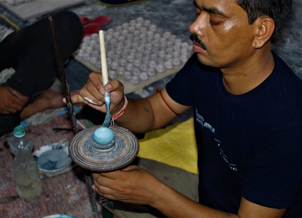A.B. Enterprises skilled worker crafting decorative cast iron and ceramic hardware